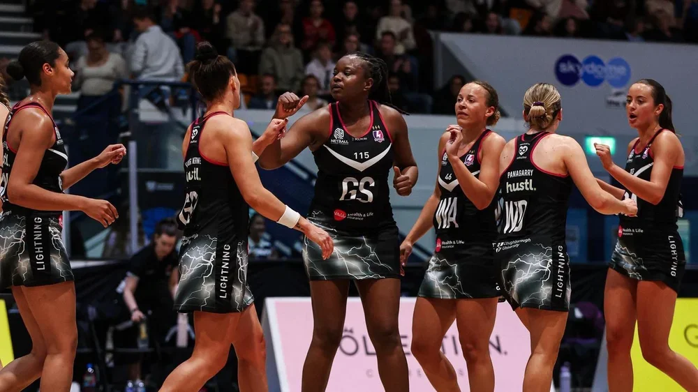A group of five Loughborough Lightning players congratulate each other